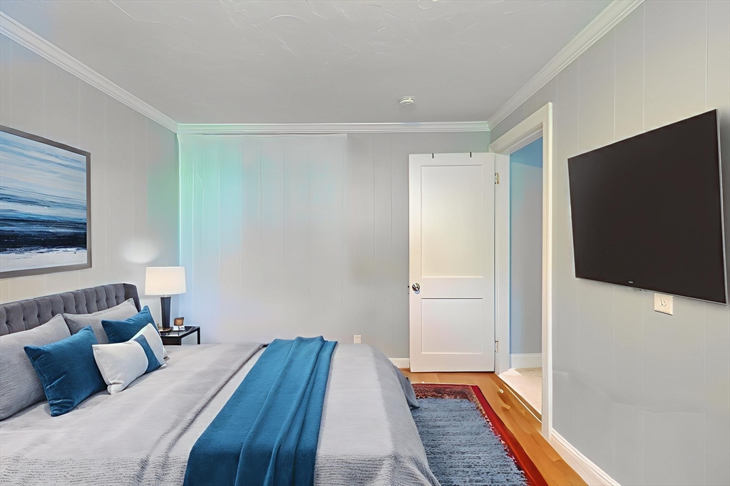 23 Superior Road Worcester, MA 01604 - Photo 16 of 32 a bedroom with a bed and a flat screen tv