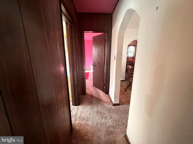 a bathroom with a sink vanity mirror and toilet