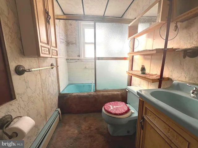 a bathroom with a sink and mirror