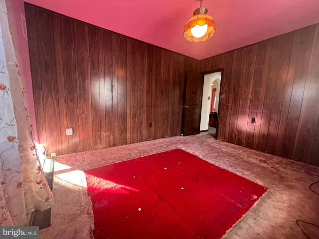 a bed room with a bed and a window