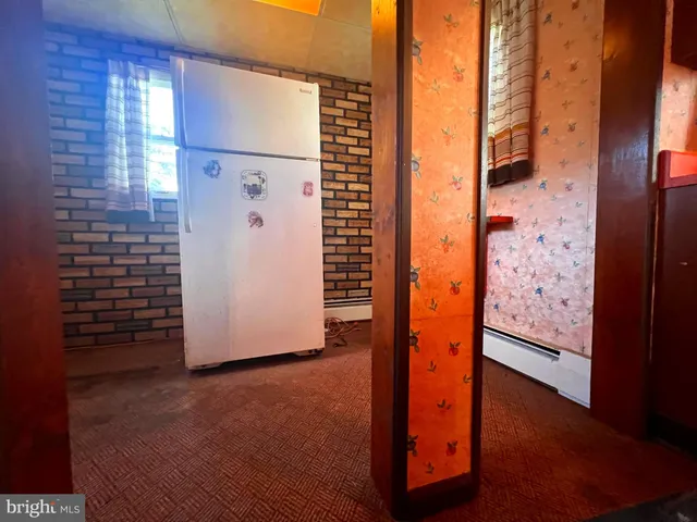 a kitchen with stainless steel appliances granite countertop a stove and a refrigerator