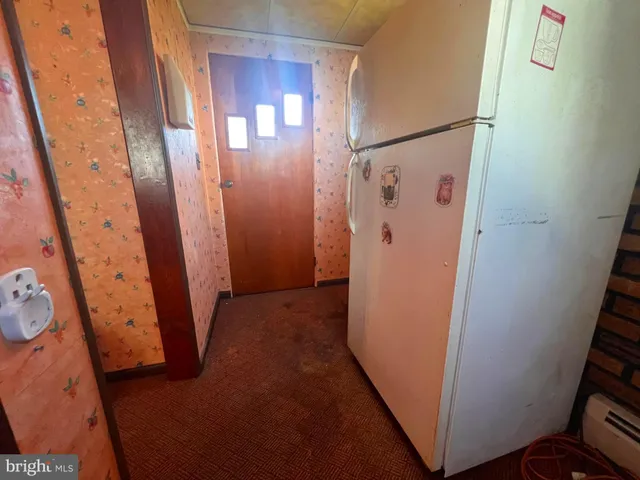 a view of a workspace with furniture