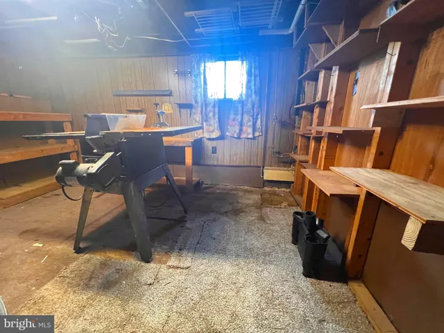 a bedroom with a bed and a mirror