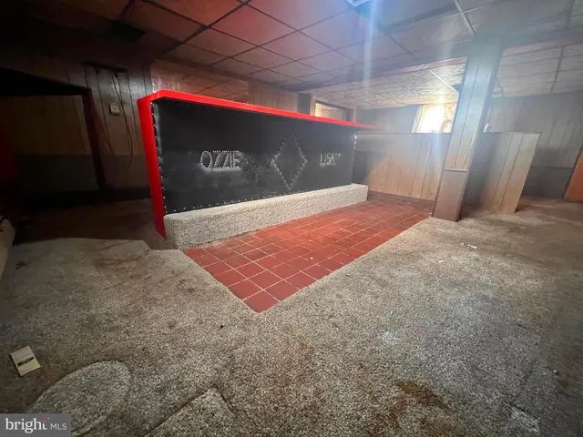 a room with wooden furniture and a projector