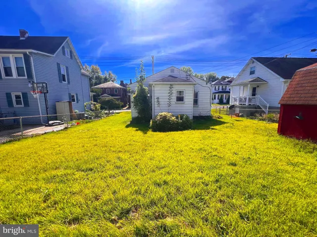 a swimming pool with outdoor seating