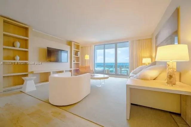 a living room with couches and a flat screen tv