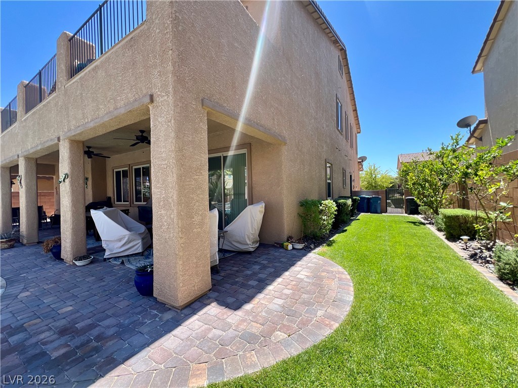 9724 University Ridge Avenue Las Vegas, NV 89149 - Photo 20 of 61 An inviting covered patio featuring robust columns and a patterned paver floor.