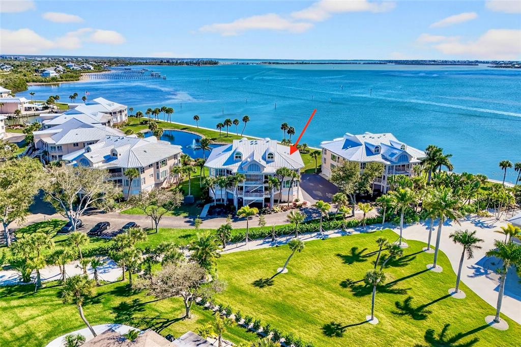 a view of swimming pool with a table and chairs in patio