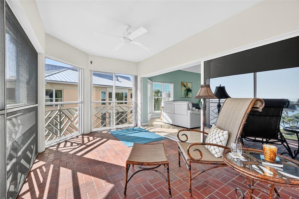 11000 Placida Road, Unit 2804 Placida, FL 33946 - Photo 12 of 56 a room with furniture and wooden floor