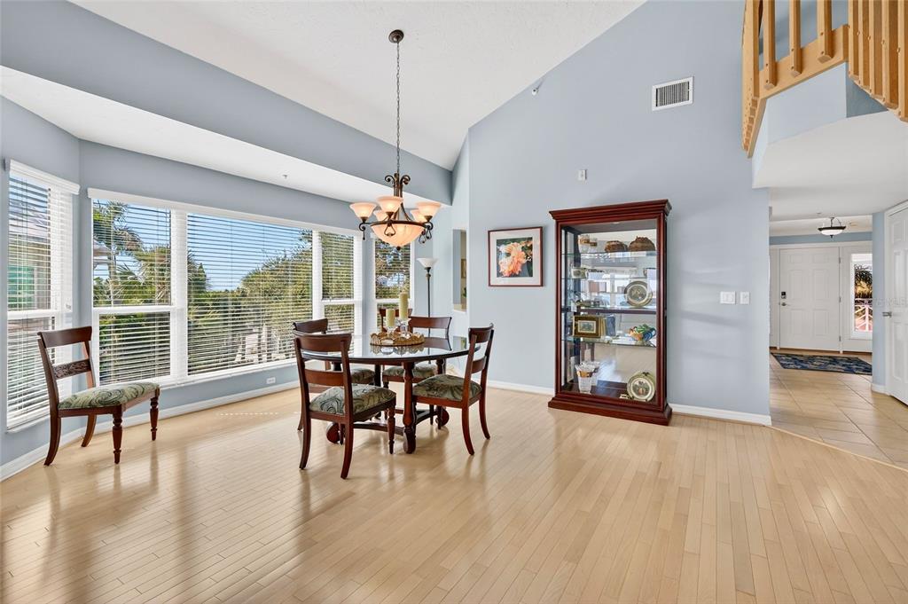 11000 Placida Road, Unit 2804 Placida, FL 33946 - Photo 17 of 56 a view of a dining room with furniture window and wooden floor