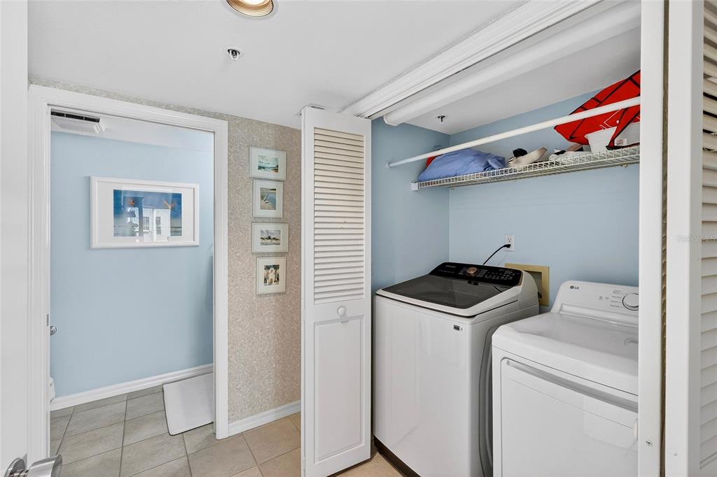 11000 Placida Road, Unit 2804 Placida, FL 33946 - Photo 26 of 56 a utility room with dryer and washer