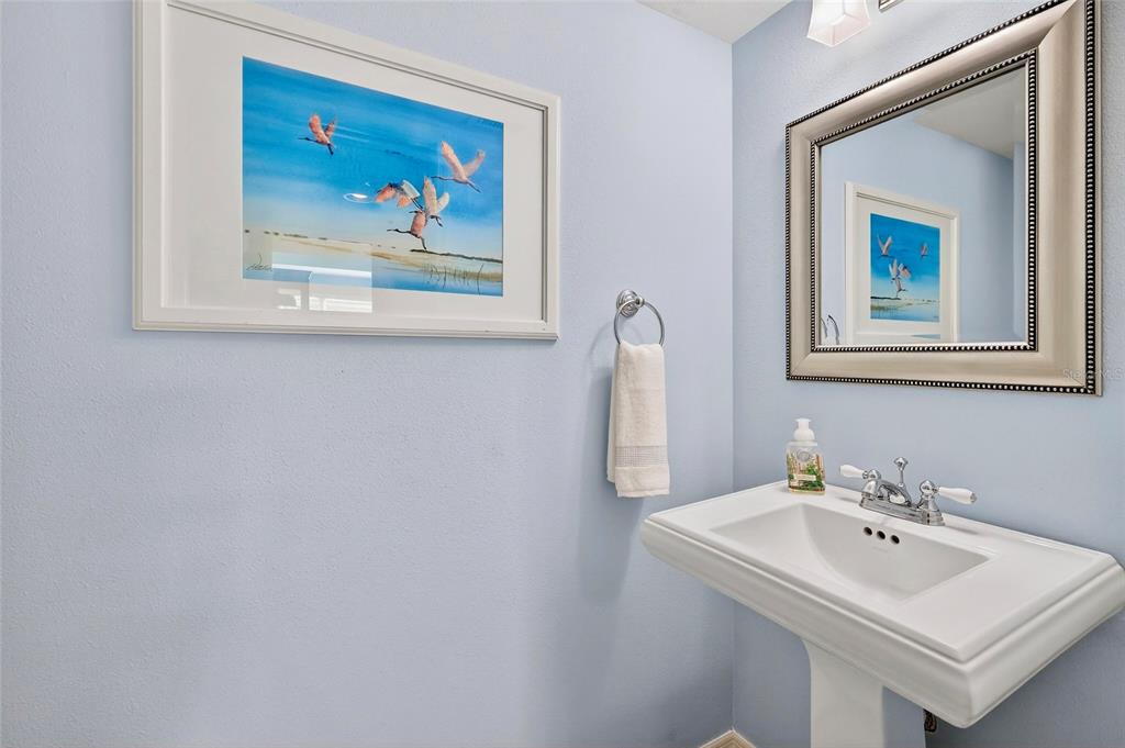 11000 Placida Road, Unit 2804 Placida, FL 33946 - Photo 27 of 56 a bathroom with a sink and a mirror