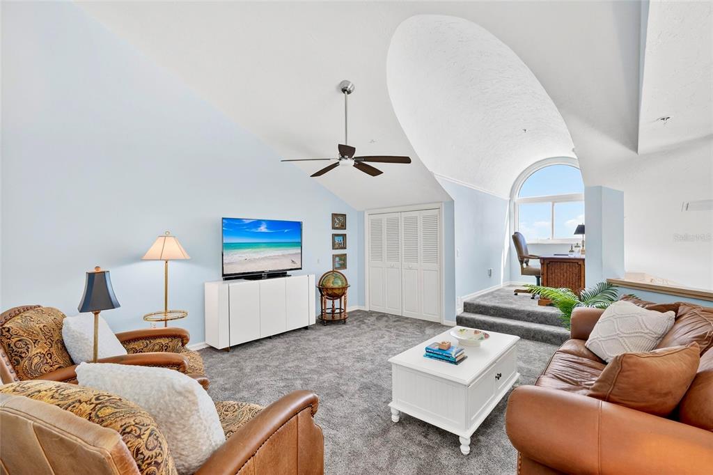 11000 Placida Road, Unit 2804 Placida, FL 33946 - Photo 28 of 56 a living room with furniture and a chandelier