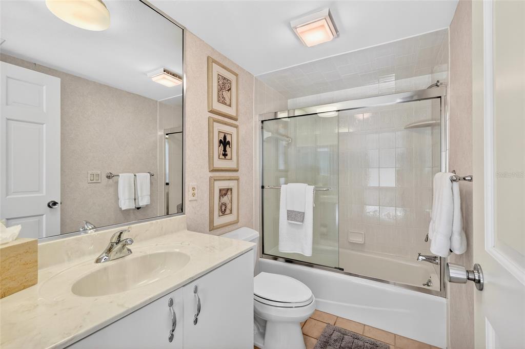 11000 Placida Road, Unit 2804 Placida, FL 33946 - Photo 31 of 56 a bathroom with a sink toilet and shower