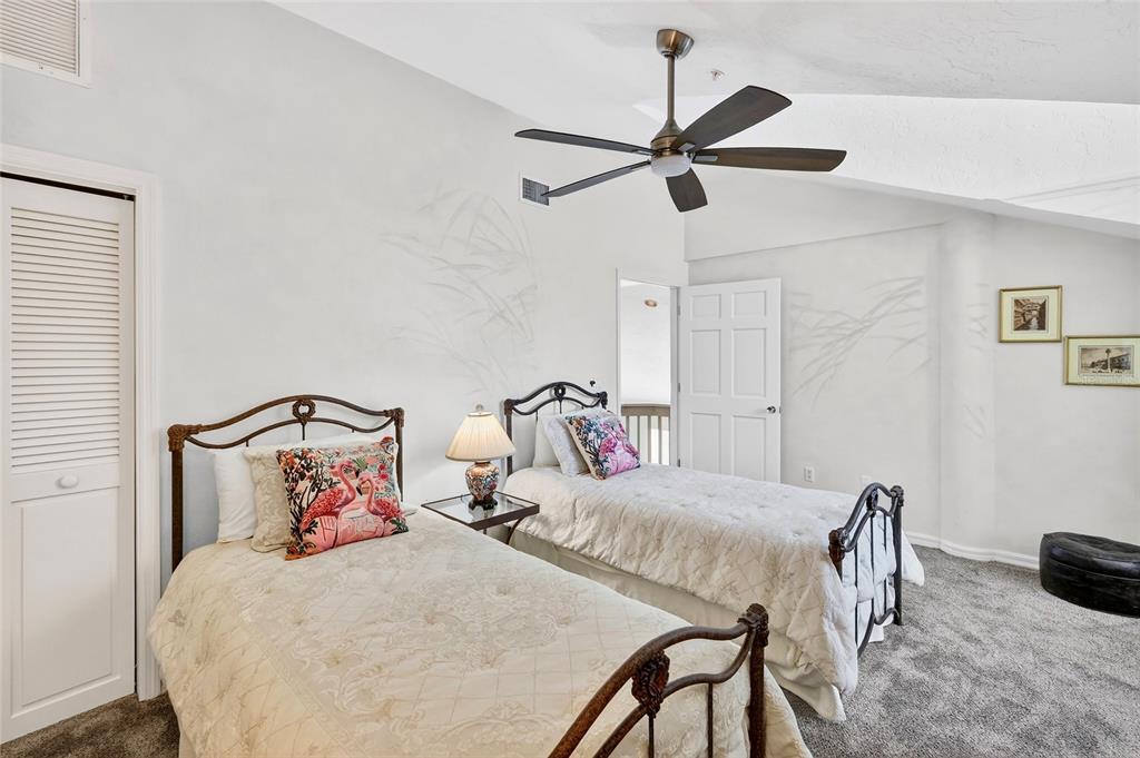 11000 Placida Road, Unit 2804 Placida, FL 33946 - Photo 33 of 56 a bedroom with a bed and a chandelier