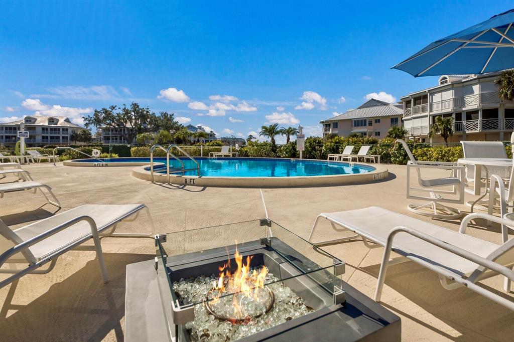 11000 Placida Road, Unit 2804 Placida, FL 33946 - Photo 41 of 56 a view of a swimming pool with lounge chairs