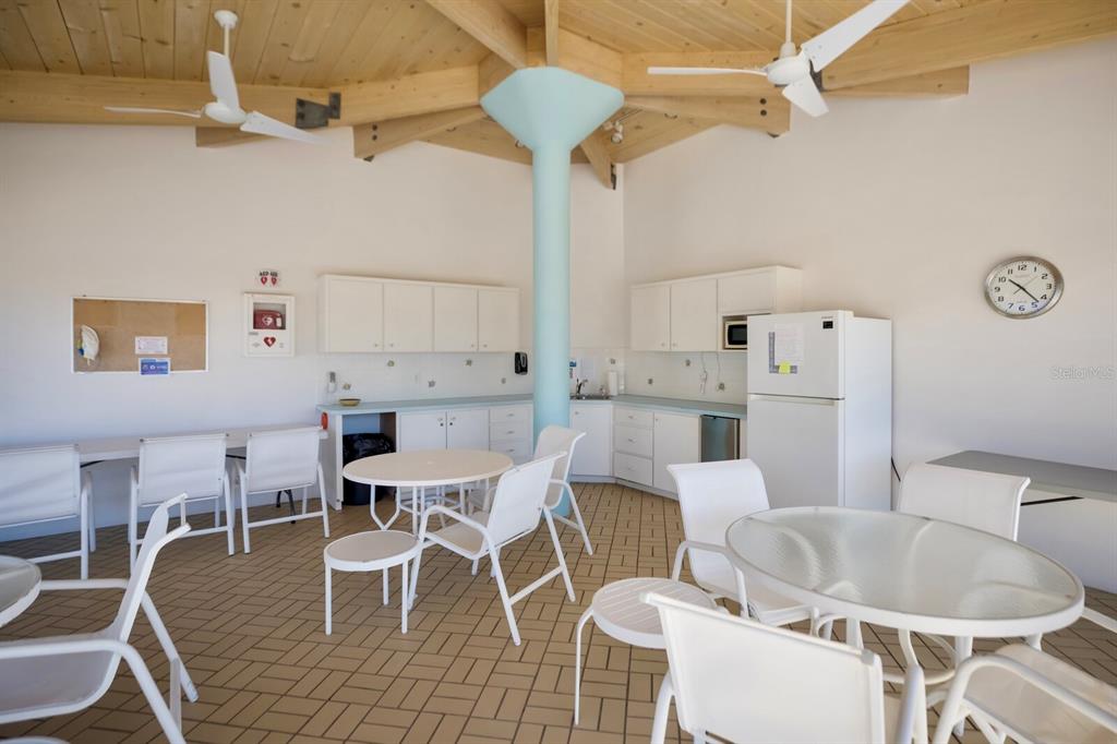 11000 Placida Road, Unit 2804 Placida, FL 33946 - Photo 43 of 56 a dining room with furniture and wooden floor