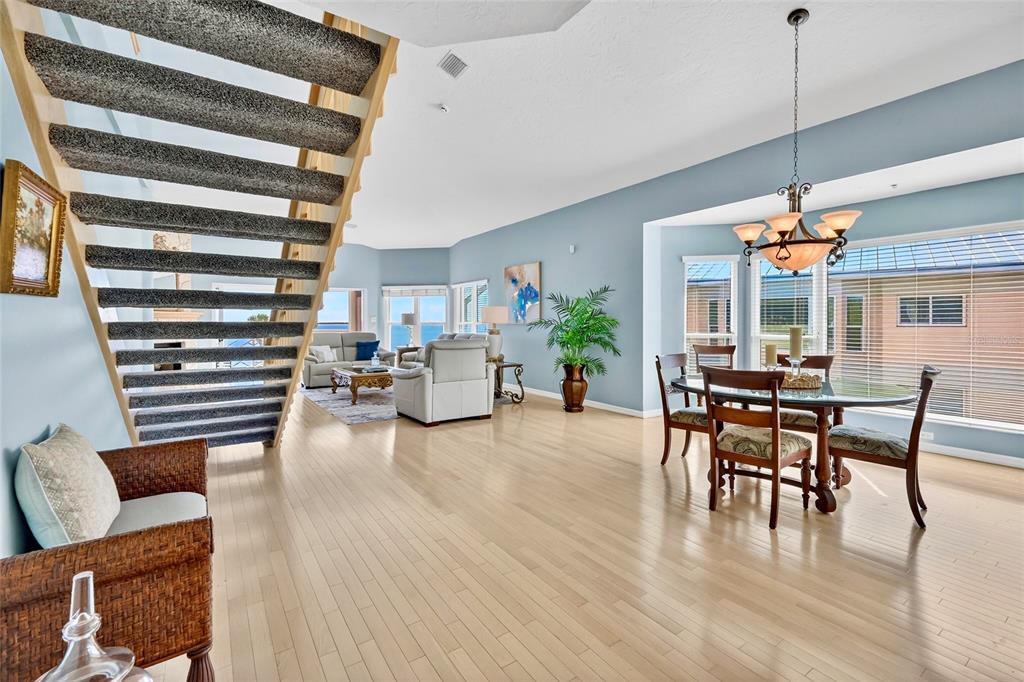 11000 Placida Road, Unit 2804 Placida, FL 33946 - Photo 5 of 56 a dining room with furniture and wooden floor
