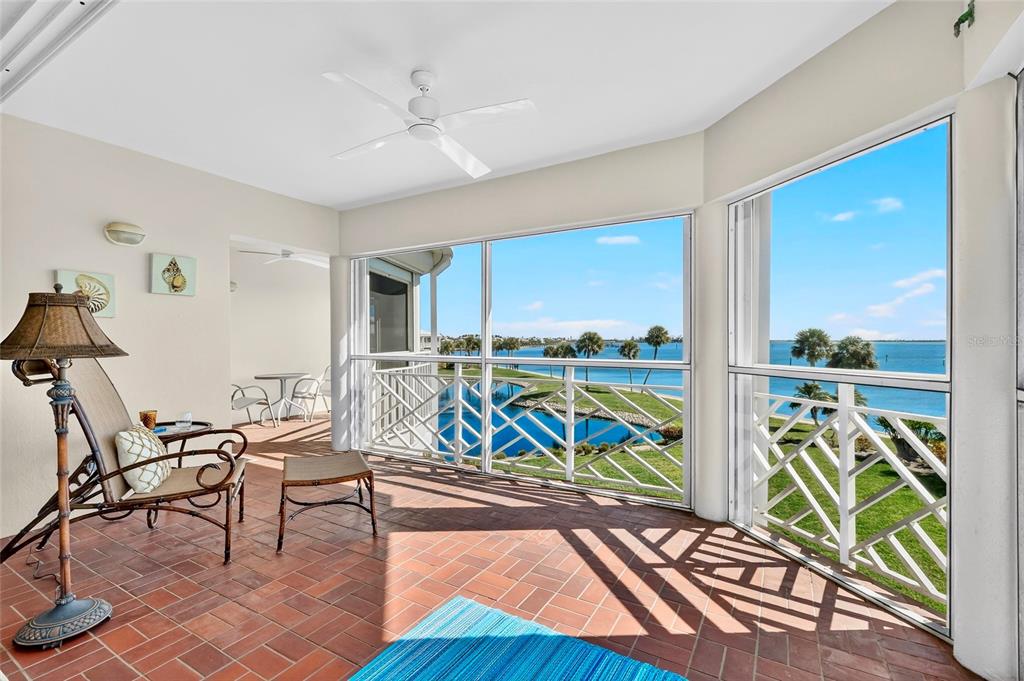 11000 Placida Road, Unit 2804 Placida, FL 33946 - Photo 9 of 56 a view of a room with furniture wooden floor and windows