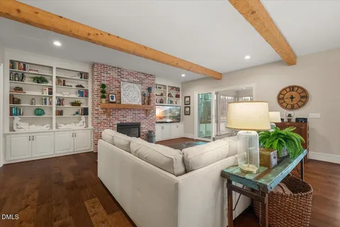 a kitchen with stainless steel appliances a stove a sink and a refrigerator