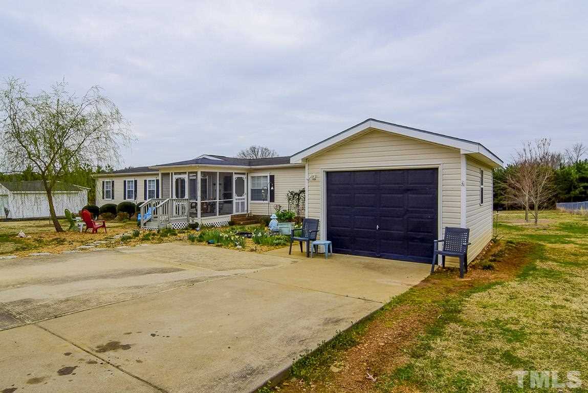 10129 Smith Road Middlesex, NC 27557 - Photo 2 of 25 a front view of a house with a yard and garage