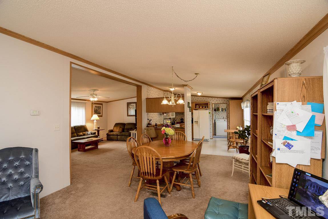 10129 Smith Road Middlesex, NC 27557 - Photo 17 of 25 a view of a dining room with furniture