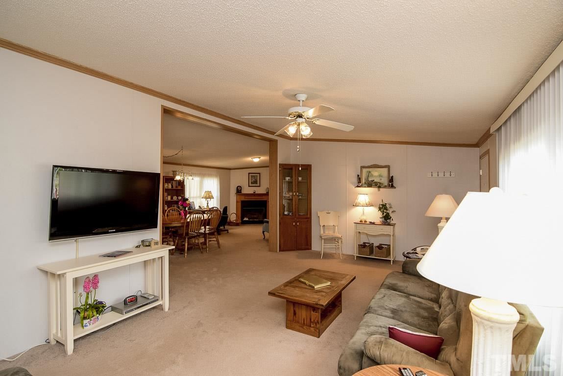 10129 Smith Road Middlesex, NC 27557 - Photo 23 of 25 a living room with furniture and a flat screen tv