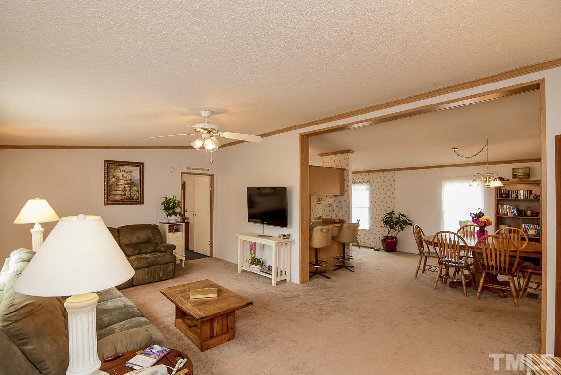 10129 Smith Road Middlesex, NC 27557 - Photo 25 of 25 a living room with furniture and a flat screen tv