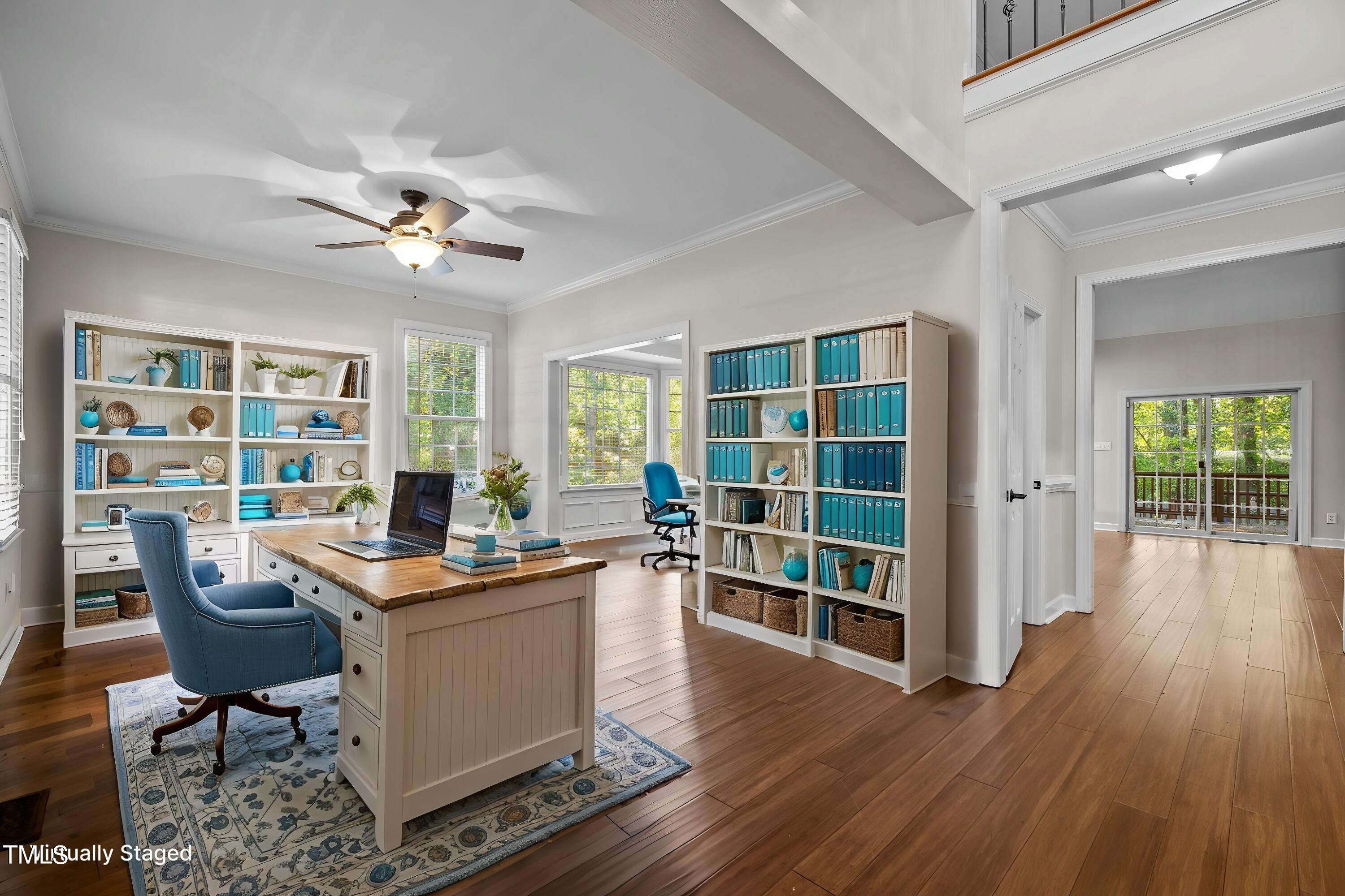 7621 Wilderness Road Raleigh, NC 27613 - Photo 4 of 60 a view of a workspace with furniture and a window