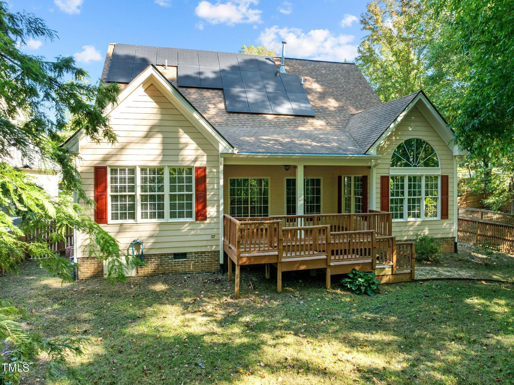 7621 Wilderness Road Raleigh, NC 27613 - Photo 54 of 60 a view of house with a yard