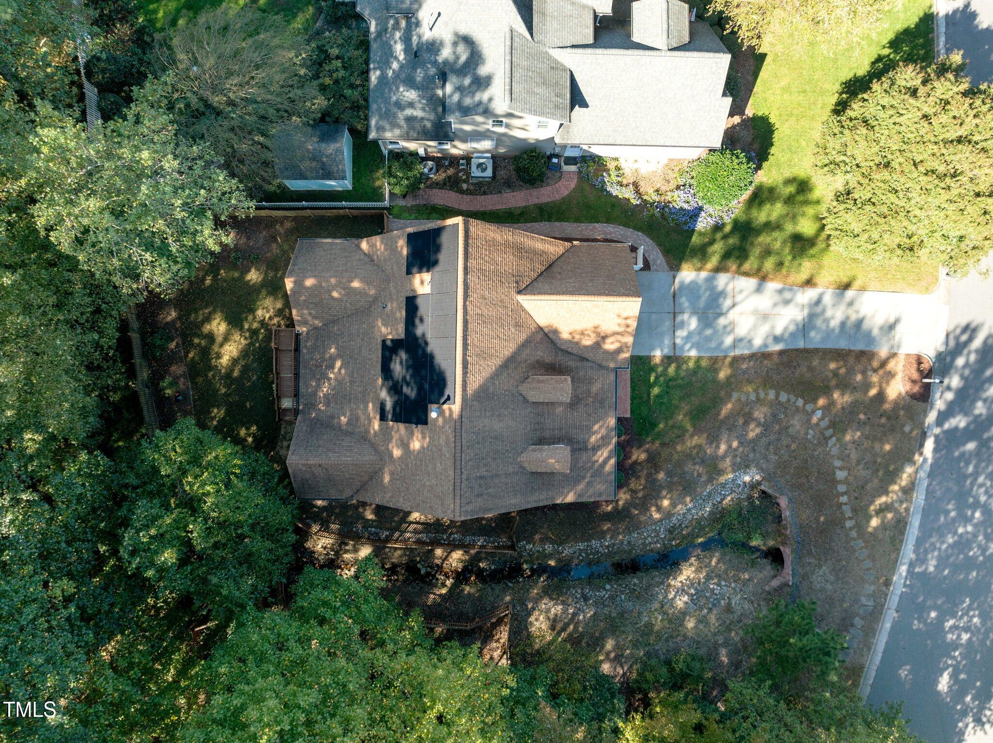 7621 Wilderness Road Raleigh, NC 27613 - Photo 58 of 60 an aerial view of a house with a yard