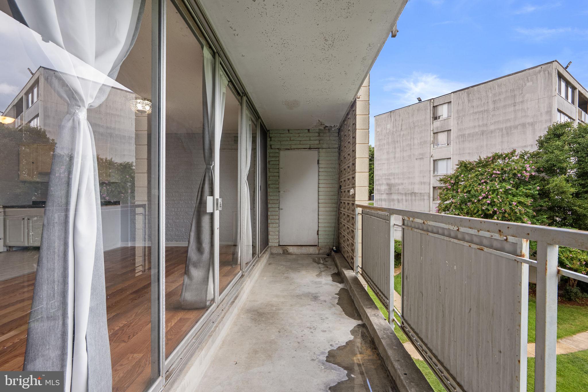 1822 Metzerott Road, Unit 103 Hyattsville, MD 20783 - Photo 18 of 25 Balcony reached through sliding glass doors