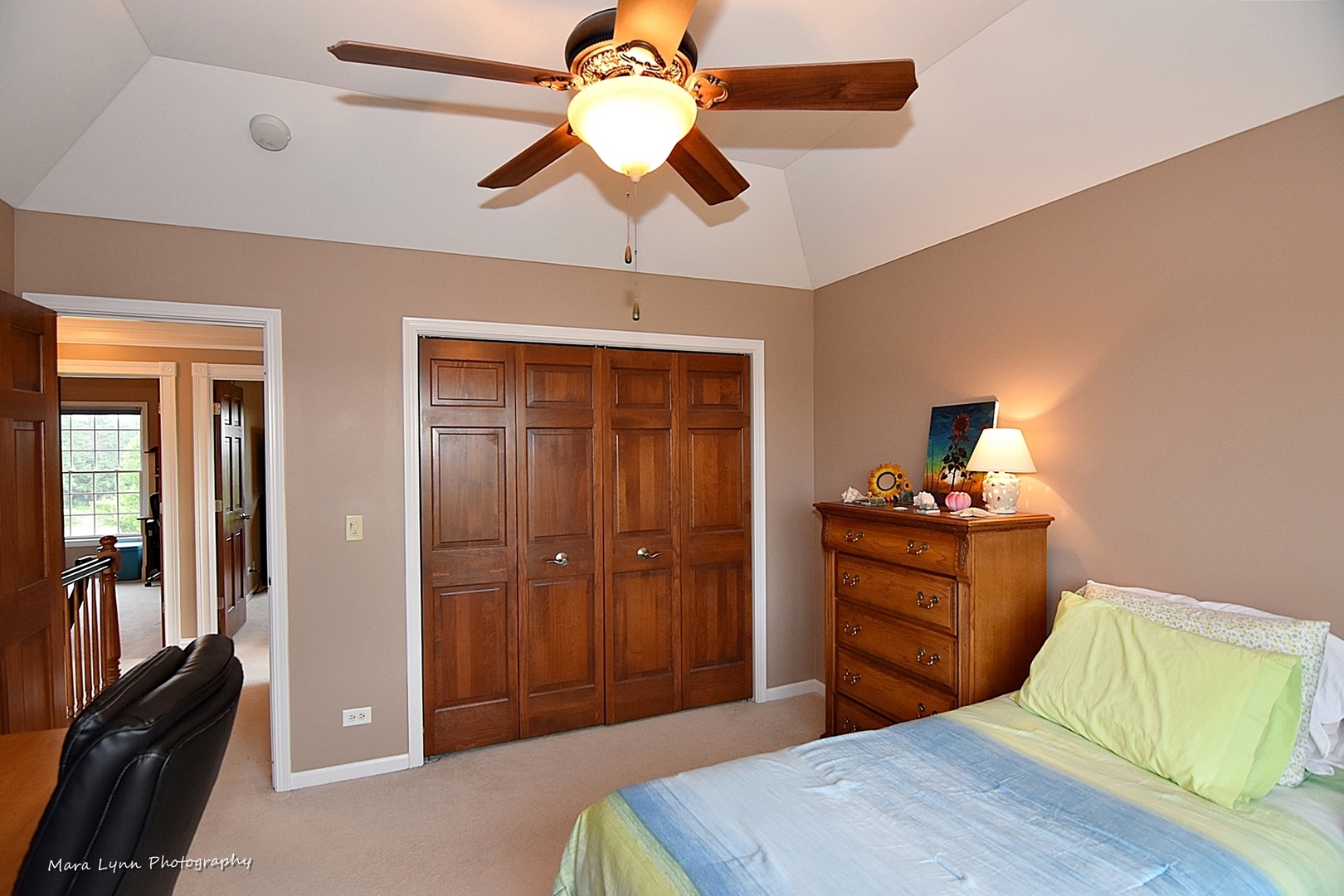 41-w035 Brown Road St. Charles, IL 60175 - Photo 18 of 33 a bedroom with a bed and a chandelier