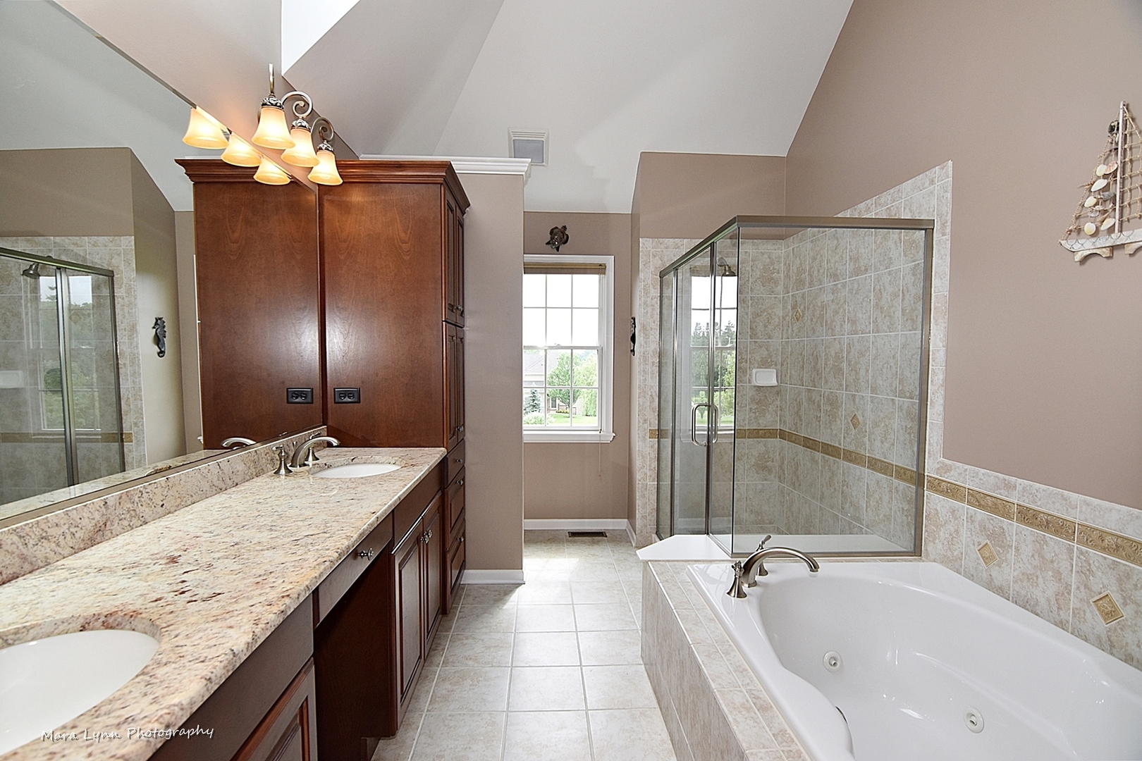 41-w035 Brown Road St. Charles, IL 60175 - Photo 28 of 33 a spacious bathroom with a granite countertop tub a double vanity sink and mirror