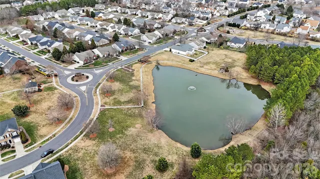 an aerial view of a residential houses with outdoor space