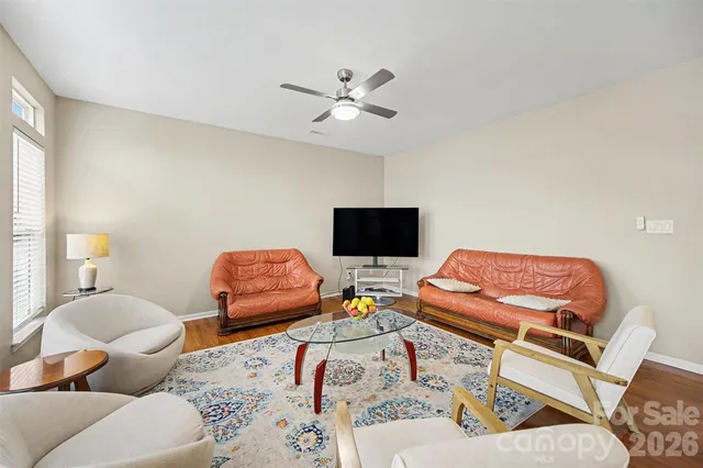 a bedroom with furniture and a flat screen tv