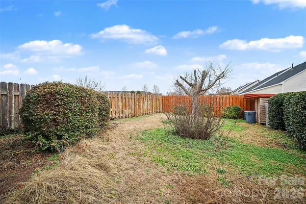 a view of a backyard with pathway