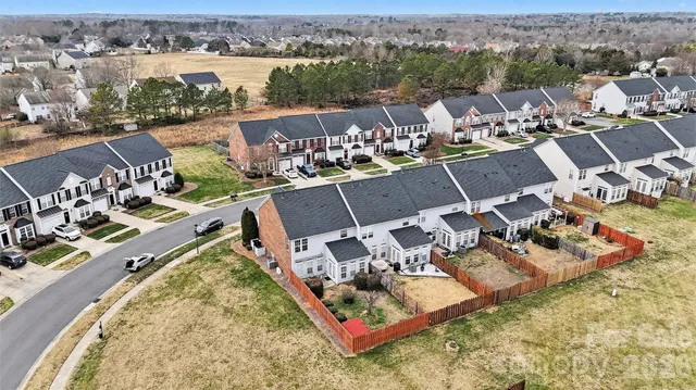 an aerial view of a house with a lake view