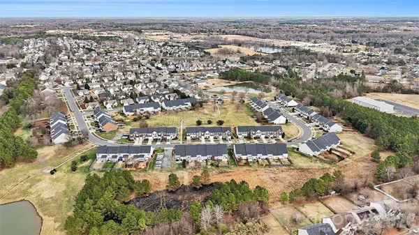 an aerial view of residential building with parking space