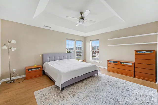 a bedroom with a bed and dresser