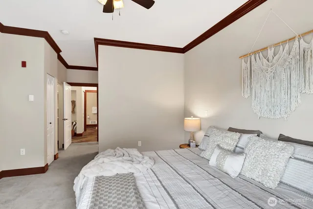a view of a hallway with wooden floor and entryway