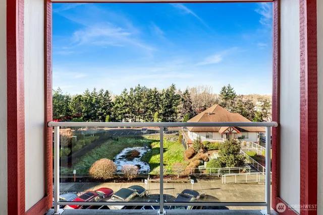 a view of a dining room with furniture and a chandelier