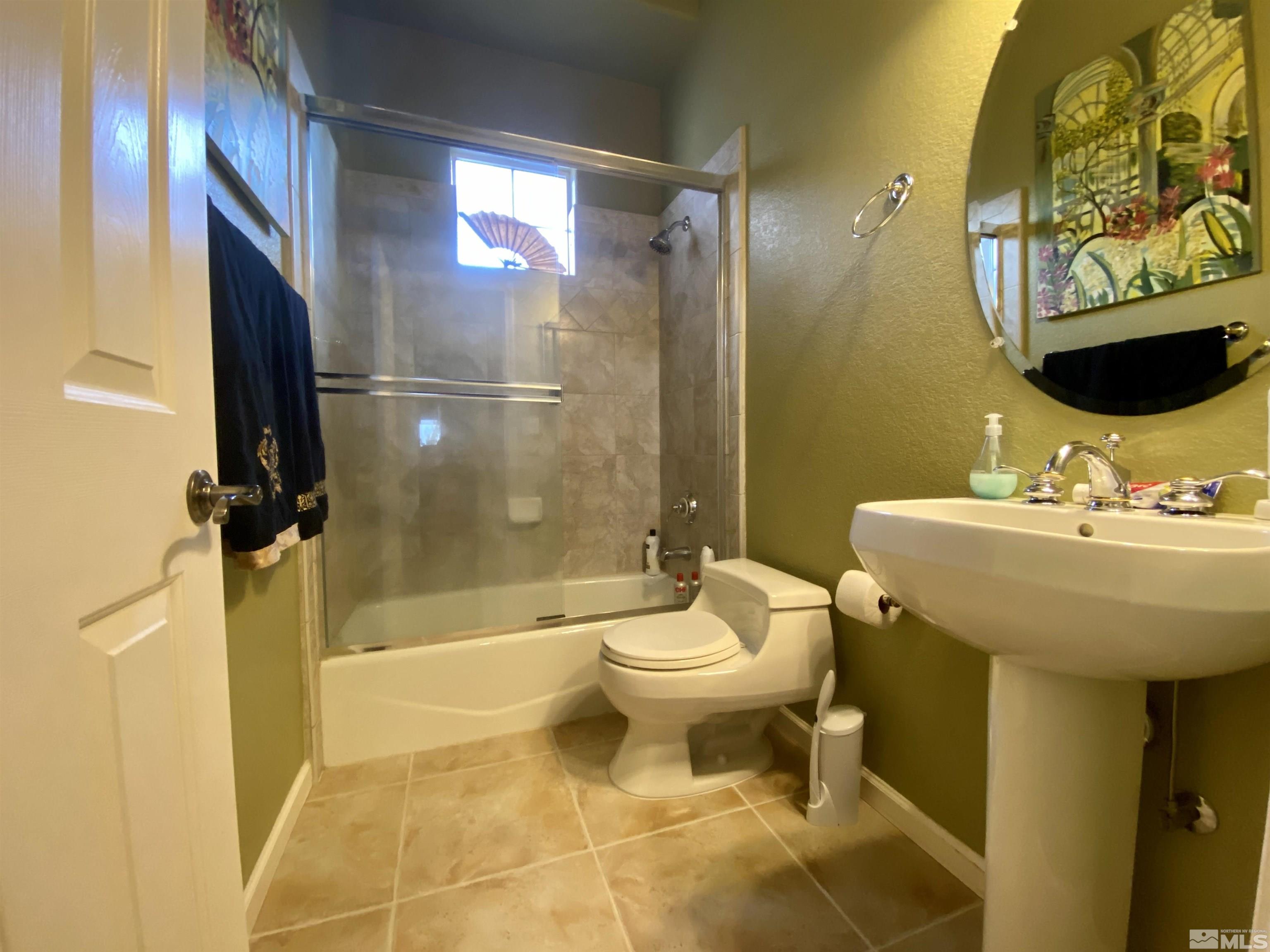 755 Sandoval Road Reno, NV 89511 - Photo 17 of 40 a bathroom with a sink toilet and shower