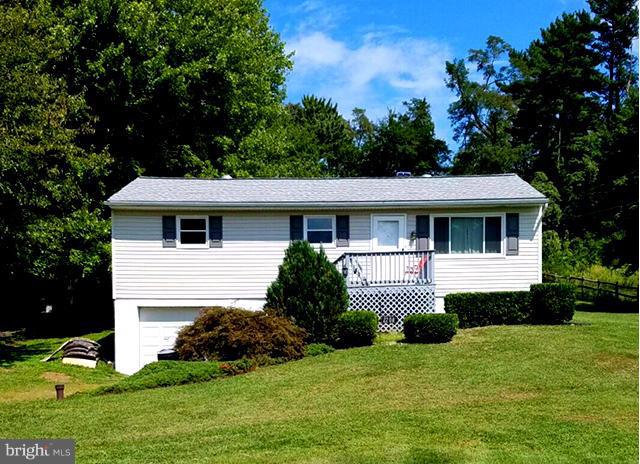 2208 Snow Road Edgewood, MD 21040 - Photo 1 of 23 a front view of a house with a yard