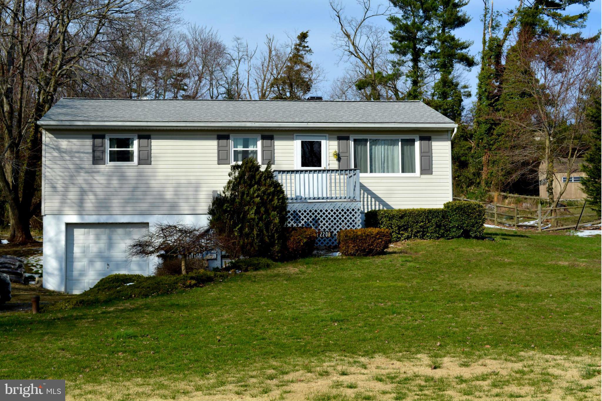 2208 Snow Road Edgewood, MD 21040 - Photo 2 of 23 a front view of a house with a garden
