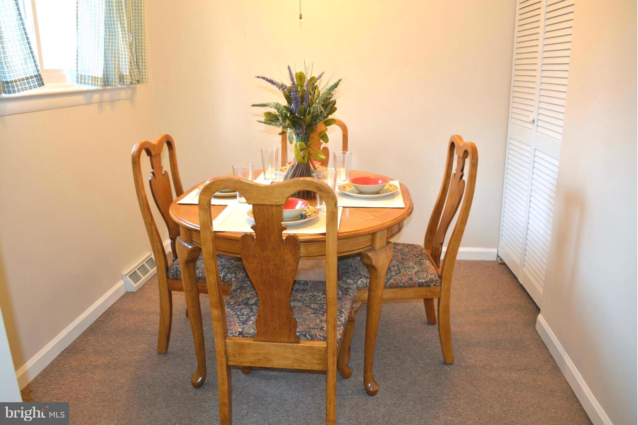 2208 Snow Road Edgewood, MD 21040 - Photo 13 of 23 a view of a dining room with furniture and a window