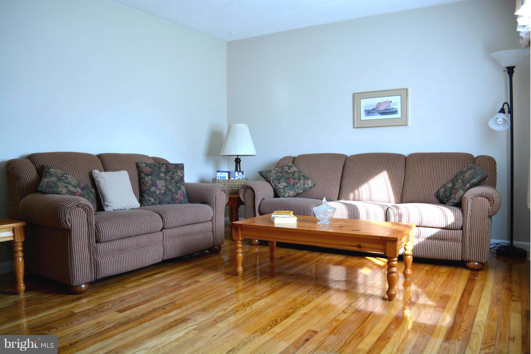 2208 Snow Road Edgewood, MD 21040 - Photo 18 of 23 a living room with furniture and a wooden floor
