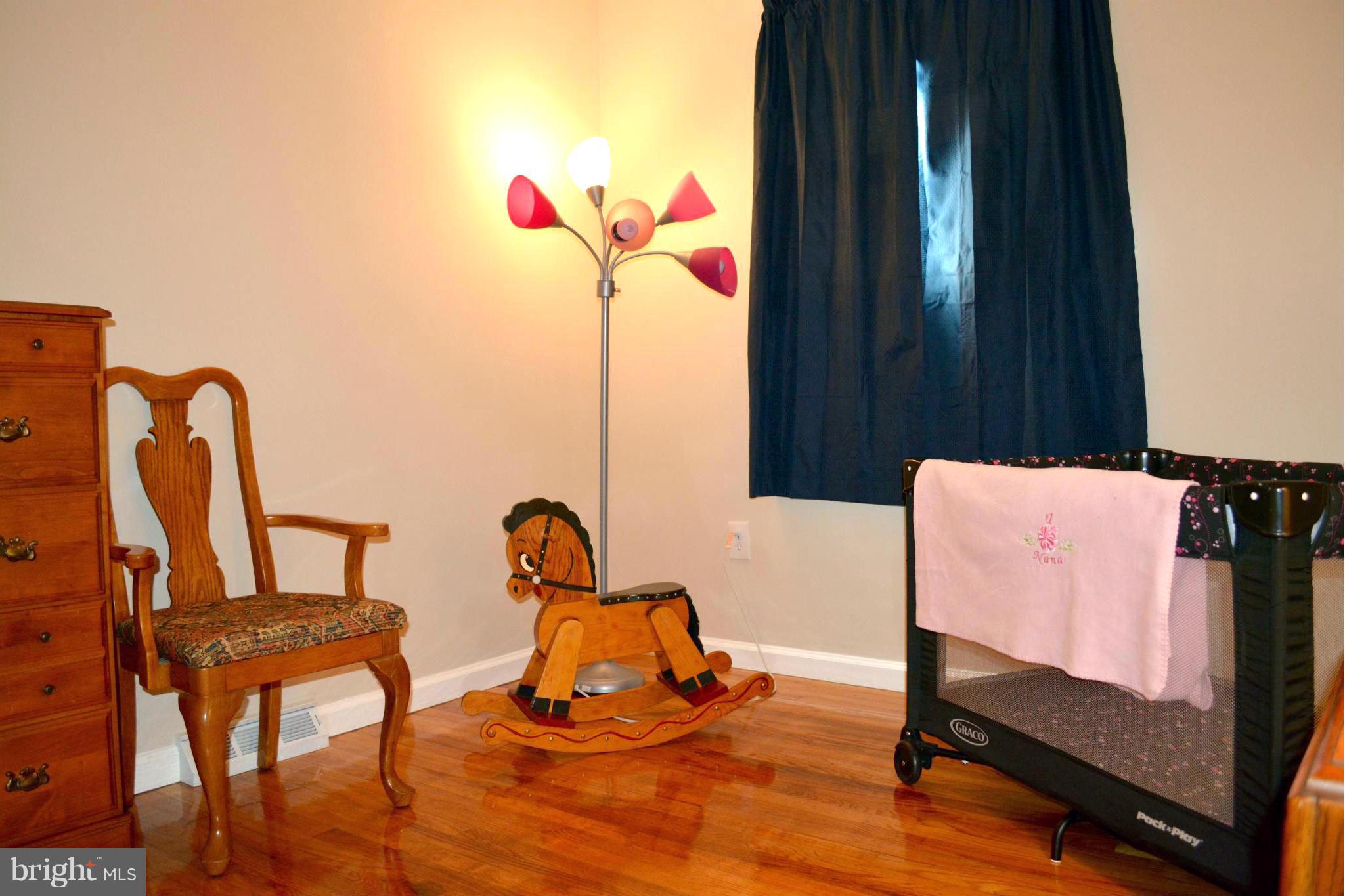 2208 Snow Road Edgewood, MD 21040 - Photo 3 of 23 a bedroom with furniture and a window
