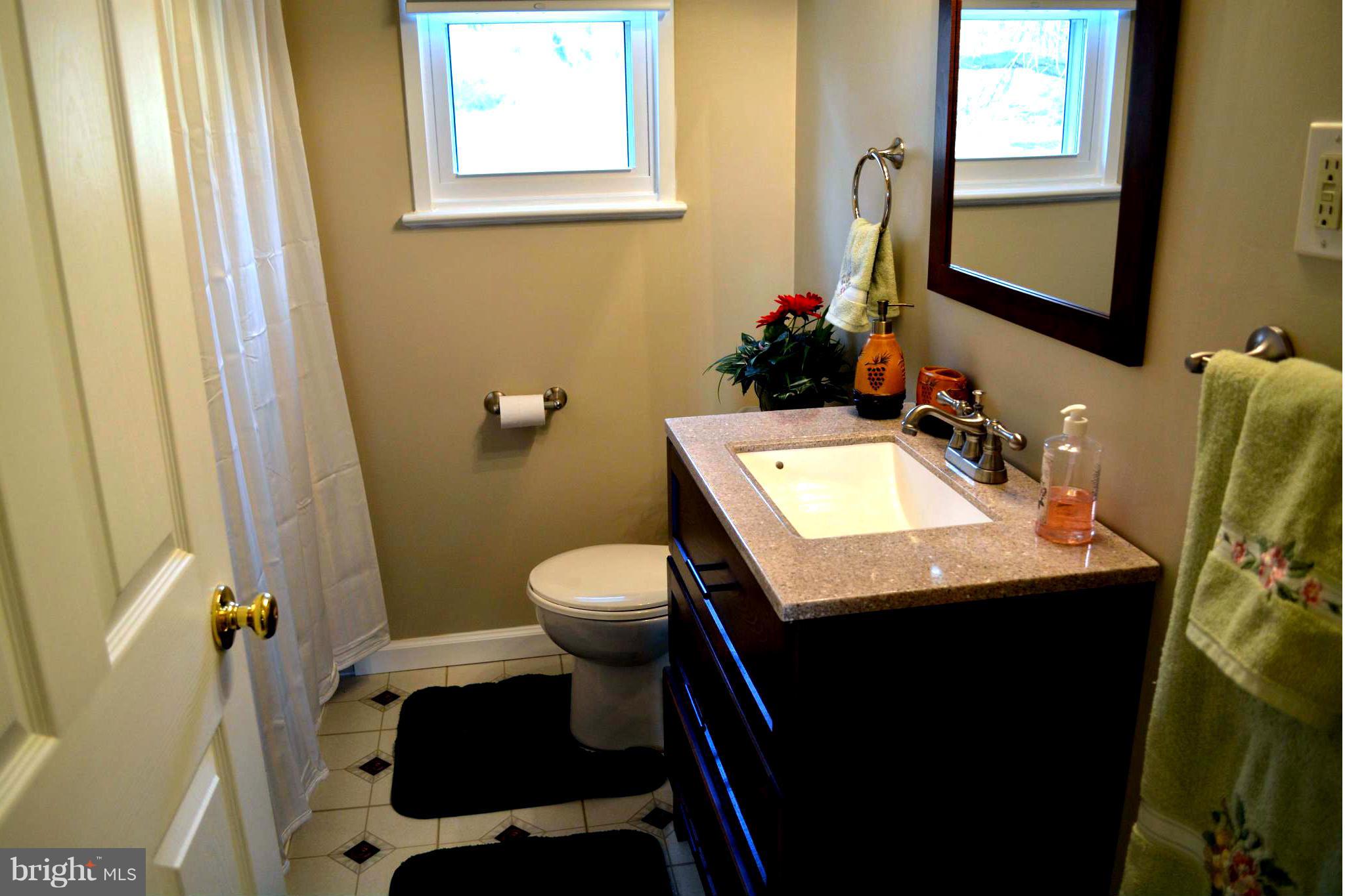 2208 Snow Road Edgewood, MD 21040 - Photo 5 of 23 a bathroom with a sink and a toilet