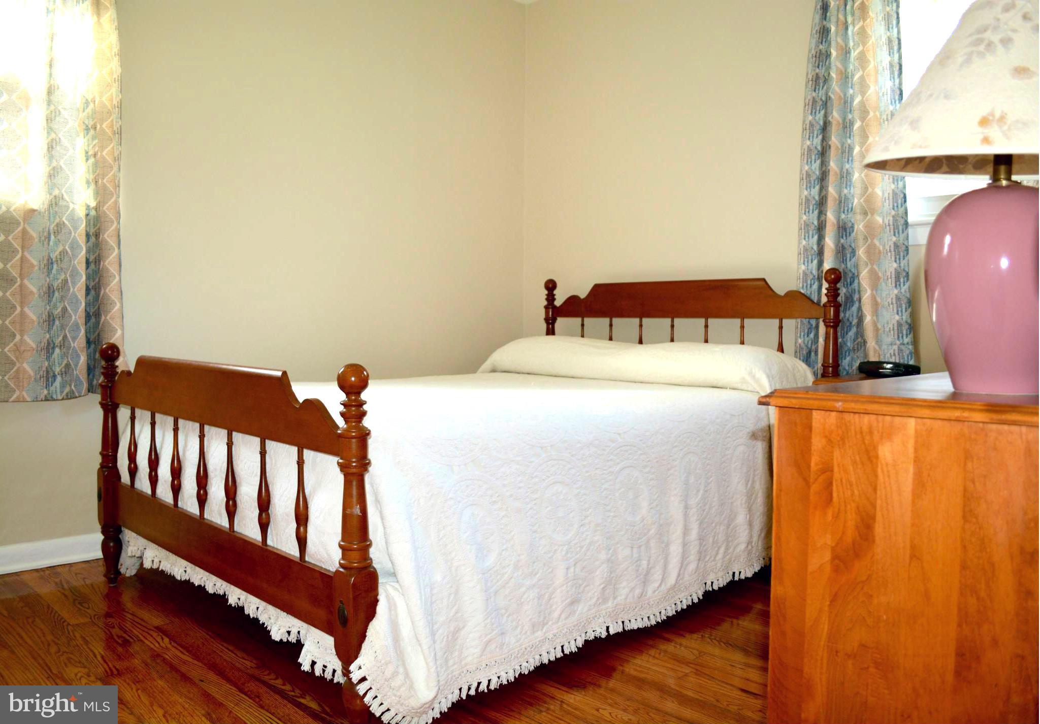 2208 Snow Road Edgewood, MD 21040 - Photo 7 of 23 a bedroom with a bed and wooden floor